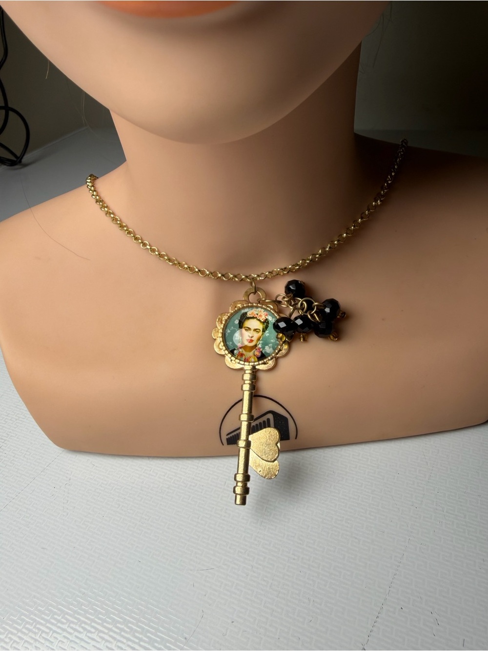 Gold Key Pendant Necklace with Frida Portrait and Black Bead Accents